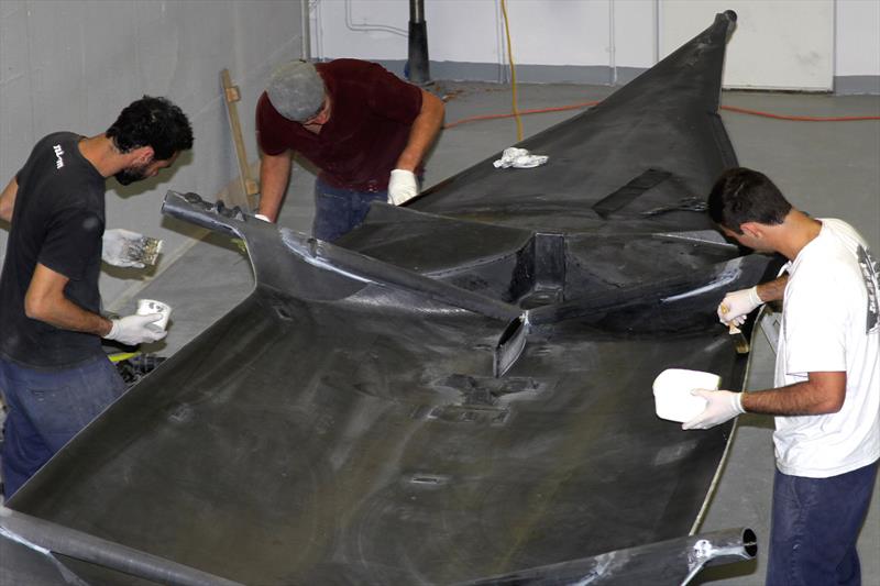 (l-r) Dan Grilk, Dylan Neilson and Nick Hord prepare the next new hull for the 18ft Skiff 2016 season photo copyright Frank Quealey taken at  and featuring the 18ft Skiff class