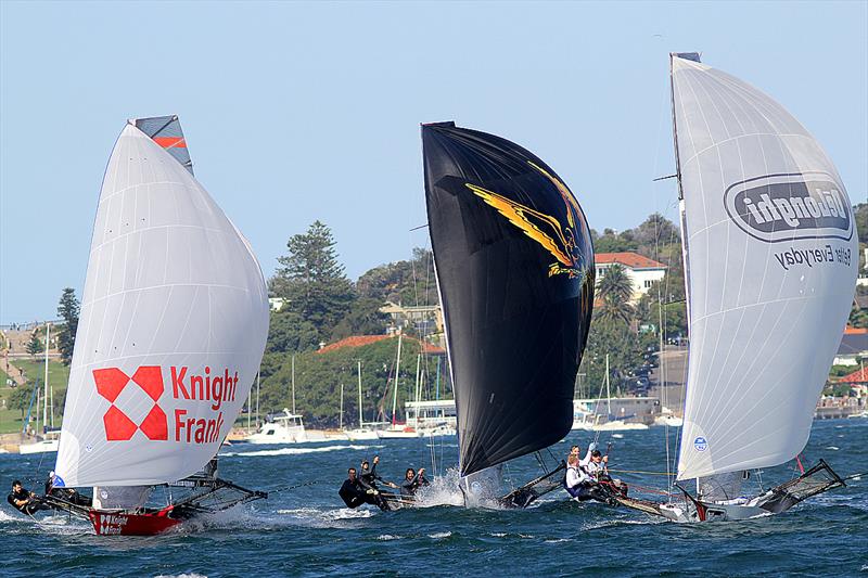 Knight Frank, Triple M and De'Longhi battle for fourth position on the spinnaker run from the Beashel Buoy during race 1 of the 18ft Skiff JJ Giltinan Trophy photo copyright Frank Quealey taken at Australian 18 Footers League and featuring the 18ft Skiff class