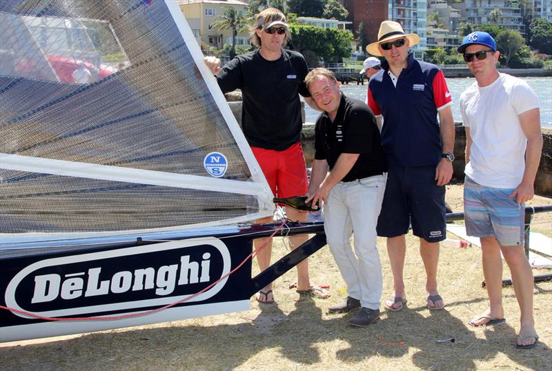 Gregg Lawrance of De'Longhi pours the traditional champagne over the new skiff in the Double Bay rigging area photo copyright Frank Quealey taken at Australian 18 Footers League and featuring the 18ft Skiff class