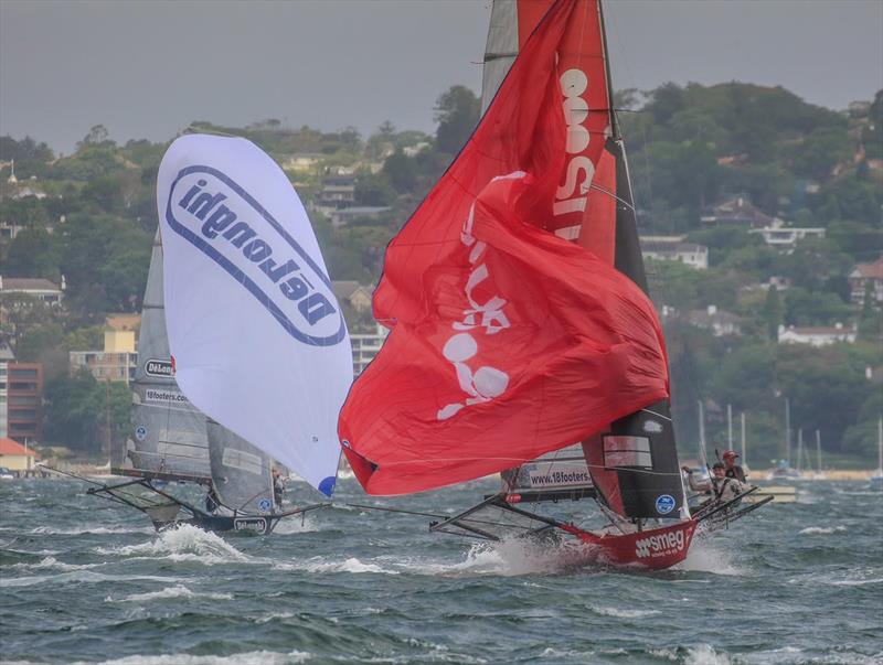 Smeg and De'Longhi crews battle with spinnakers in the strong wind during the 18ft Skiff President's Trophy race photo copyright Michael Chittenden taken at Australian 18 Footers League and featuring the 18ft Skiff class