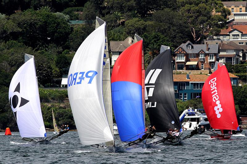 Close spinnaker action on the first downwind leg in race 11 of the 18ft Skiff Club Championship photo copyright Frank Quealey taken at Australian 18 Footers League and featuring the 18ft Skiff class