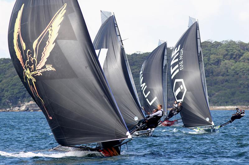 Triple M leads a group of skiffs off Clark Island during 18ft Skiff 2017 JJ Giltinan Championship race 5 photo copyright Frank Quealey taken at Australian 18 Footers League and featuring the 18ft Skiff class