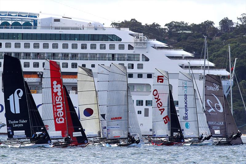 18ft Skiff 2017 JJ Giltinan Championship race 5 start with a spectacular backdrop photo copyright Frank Quealey taken at Australian 18 Footers League and featuring the 18ft Skiff class