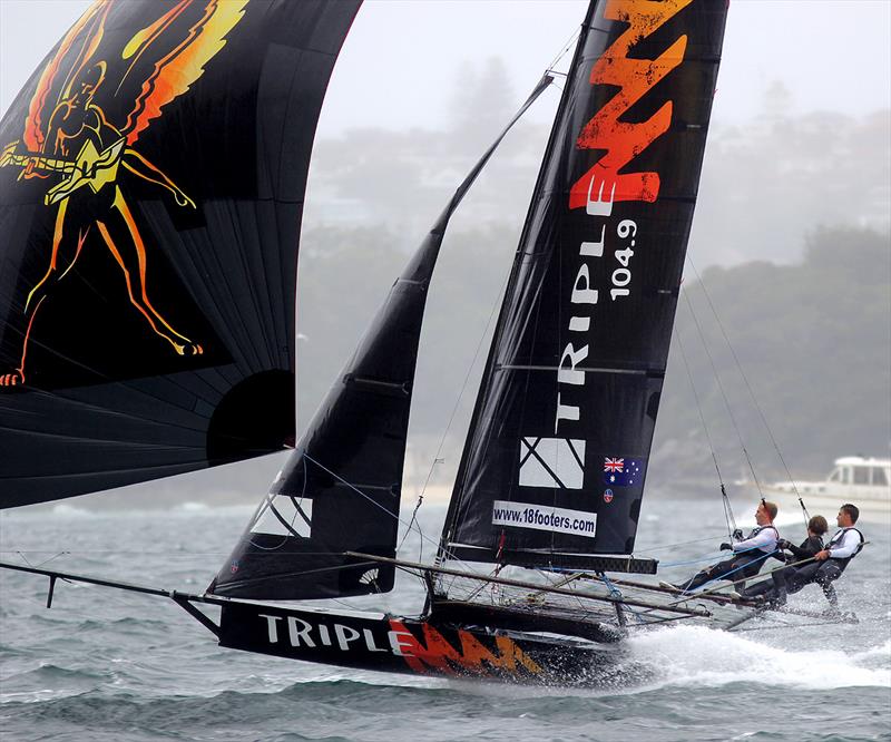 Triple M nearly airborne under spinnaker during 18ft Skiff 2017 JJ Giltinan Championship race 6 photo copyright Frank Quealey taken at Australian 18 Footers League and featuring the 18ft Skiff class