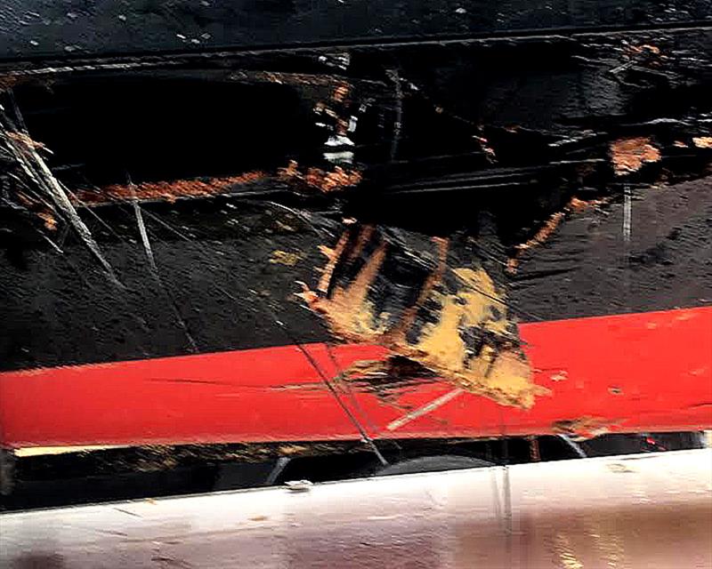 The damage to the Lumix 18ft Skiff hull photo copyright Frank Quealey taken at  and featuring the 18ft Skiff class