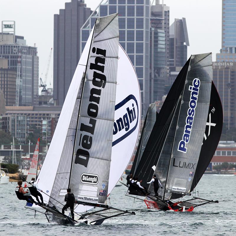 De'Longhi and Panasonic Lumix battle to find wind on the first spinnaker run out of Rose Bay in race 2 of the 18ft Skiff Spring Championship in Sydney photo copyright Frank Quealey taken at Australian 18 Footers League and featuring the 18ft Skiff class