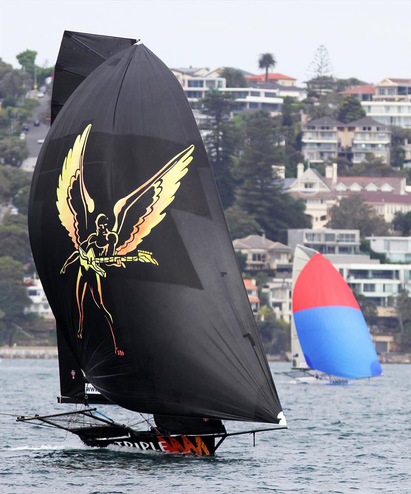Triple M crosses the finish line with second placed Yandoo in the distance in race 2 of the 18ft Skiff Spring Championship in Sydney photo copyright Frank Quealey taken at Australian 18 Footers League and featuring the 18ft Skiff class