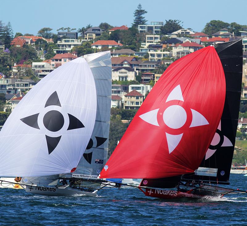 The two NOAKES skiffs (Noakes Youth with the white spinnaker and Noakesailing with red) during race 6 of the 18ft Skiff Spring Championship in Sydney photo copyright Frank Quealey taken at Australian 18 Footers League and featuring the 18ft Skiff class