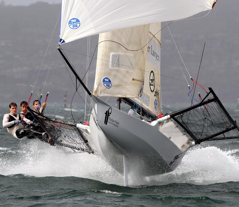 Thurlow Fisher Lawyers became airborne under spinnaker photo copyright Frank Quealey taken at Australian 18 Footers League and featuring the 18ft Skiff class