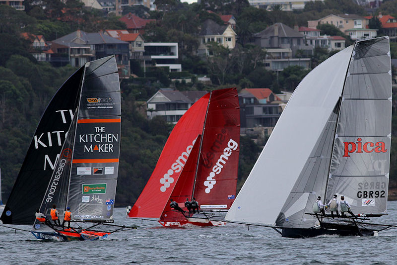 The UK's Pica with 2 local teams on the first spinnaker run in race 1 of the  64th JJ Giltinan Championship photo copyright Frank Quealey taken at Australian 18 Footers League and featuring the 18ft Skiff class