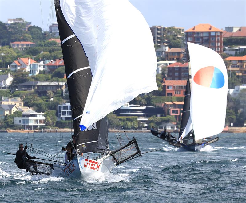 Queensland's C-Tech leads Yandoo on the spinnaker run to Chowder Bay during race 1 of the 100th 18ft Skiff Australian Championship photo copyright Michael Chittenden taken at Australian 18 Footers League and featuring the 18ft Skiff class