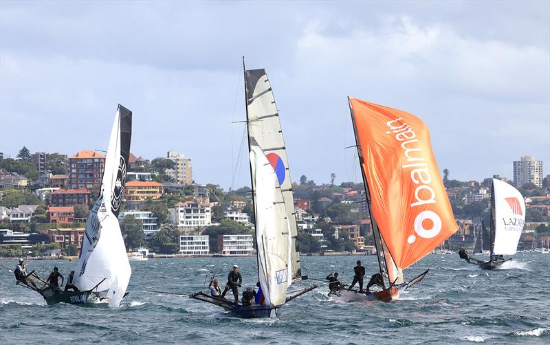 The fleet approaches the bottom mark midway through race 1 of the 100th 18ft Skiff Australian Championship photo copyright Michael Chittenden taken at Australian 18 Footers League and featuring the 18ft Skiff class