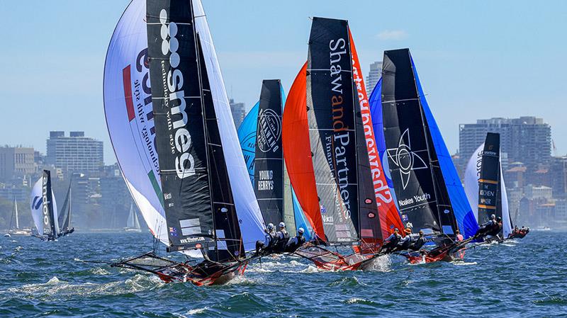 Bunched fleet on a spinnaker run last Friday evening - Australian 18ft Skiff Championship photo copyright SailMedia taken at Australian 18 Footers League and featuring the 18ft Skiff class