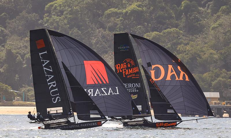 Racing for the lead on the first spinnaker run - 18ft Skiff Winnings 2024 JJ Giltinan Championship photo copyright SailMedia taken at Australian 18 Footers League and featuring the 18ft Skiff class