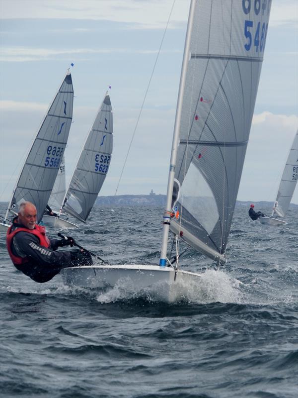 John Webster powering to windward on day 5 of the Selden Solo Nationals at North Berwick photo copyright Will Loy taken at  and featuring the Solo class