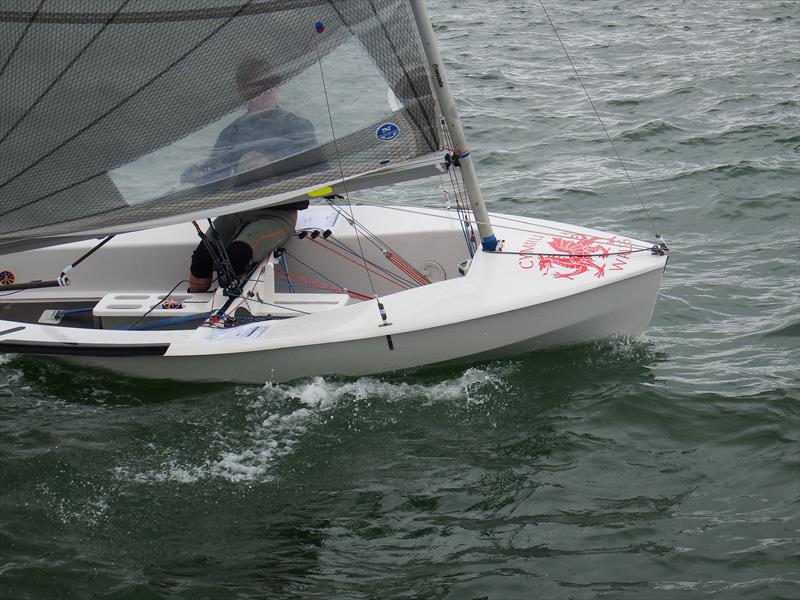 Stephen Owen sports the Welsh Dragon on his Solo on day 1 of the Superspars National Solo UK Championship photo copyright Will Loy taken at Plas Heli Welsh National Sailing Academy and featuring the Solo class