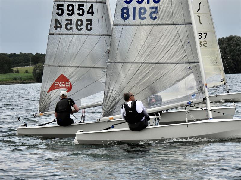 Race 2 winner Chris Brown sticks a tight cover on Oli Davenport during the Solo Inland Championship 2021 at Grafham Water photo copyright Will Loy taken at Grafham Water Sailing Club and featuring the Solo class
