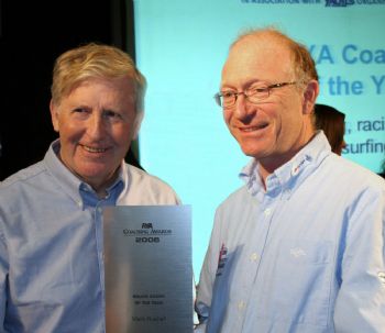 Mark Rushall receives the Squad Coach of the Year Award from Eddie Ramsden, RYA Chairman, during the RYA Dinghy Sailing Show at Alexandra Palace