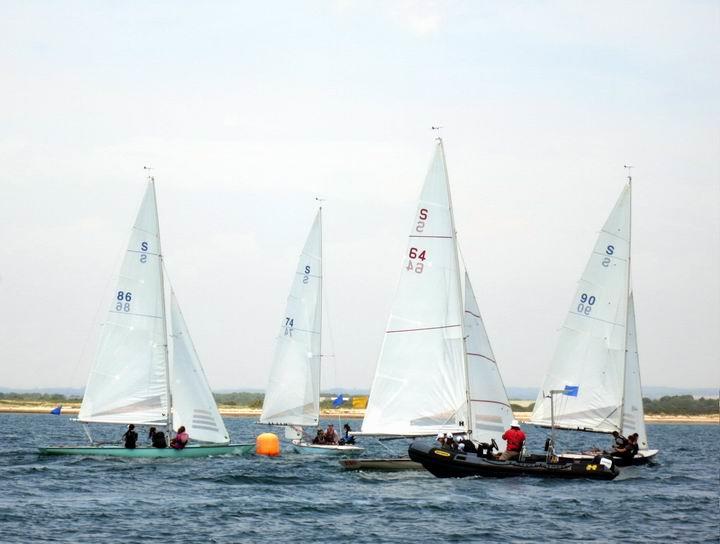 100th Varsity Match at Itchenor - Action at the leeward mark in one of the ladies races photo copyright Anthony Butler taken at Itchenor Sailing Club and featuring the Swallow class