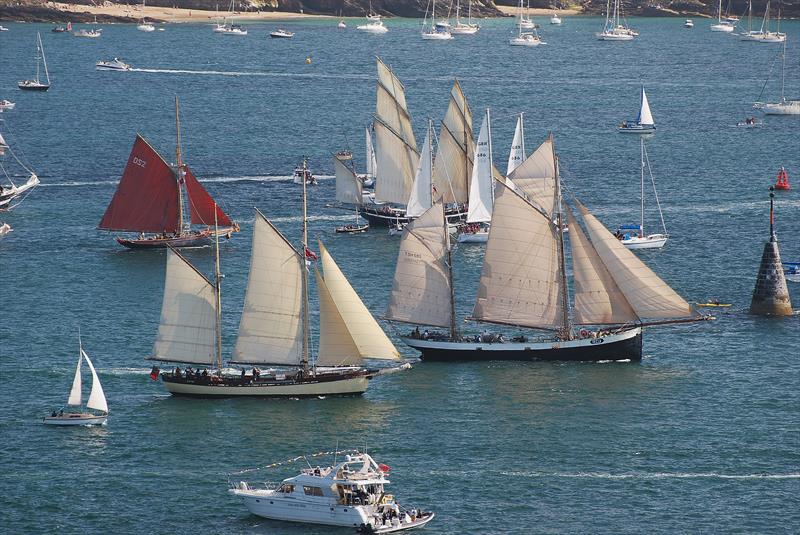 Jolie Brise (red sails), Maybe in front of her, and Tecla ahead during the Tall Ships Race 2014 start in Falmouth photo copyright Clive Reffell / www.photoboxgallery.com/ahoythere taken at  and featuring the Tall Ships class