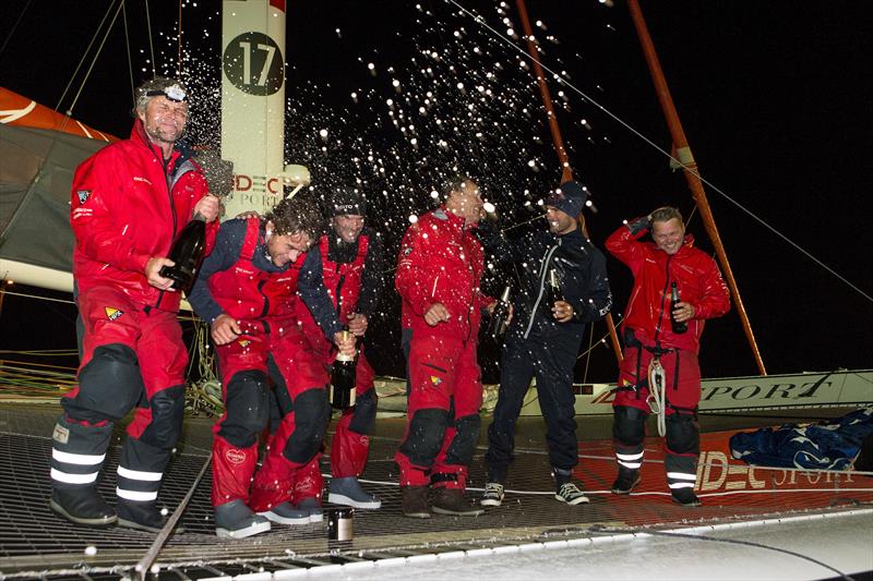IDEC SPORT team after their Jules Verne Trophy record attempt photo copyright Jean Marie Liot / DPPI / IDEC Sport taken at  and featuring the Trimaran class