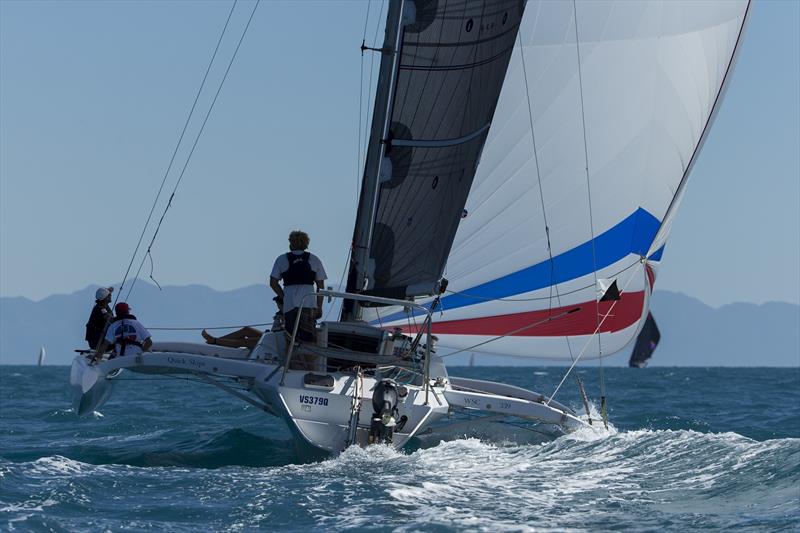 Multihull action at Airlie Beach Race Week photo copyright Andrea Francolini taken at Whitsunday Sailing Club and featuring the Trimaran class