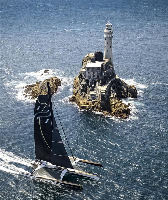 Spindrift 2 rounds the Fastnet Rock in the Rolex Fastnet Race 2013 photo copyright Kurt Arrigo / Rolex taken at  and featuring the Trimaran class
