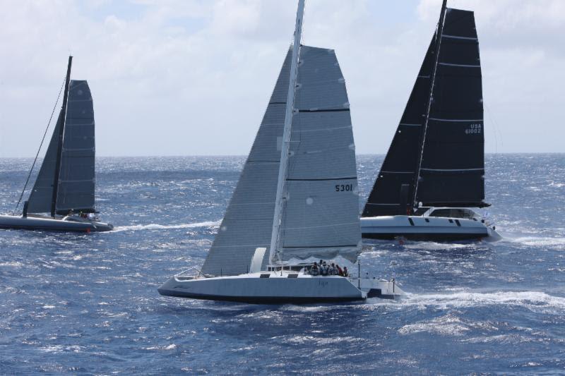 Fujin (Sail no. 5301) and Flow (USA 61002) at the start of the RORC Caribbean 600 in Antigua photo copyright RORC / Tim Wright/Photoaction.com taken at Royal Ocean Racing Club and featuring the Trimaran class