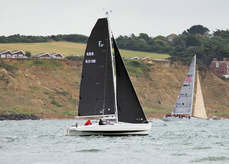 The 2023 Round the Island Race fleet pass through the Hurst narrows photo copyright Sam Jardine taken at Island Sailing Club, Cowes and featuring the Trimaran class