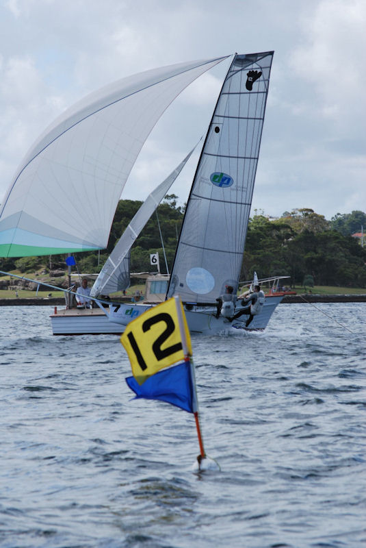 Dimension Polyant crossing to win race 1 at the 12ft Skiff Interdominions photo copyright Rob Duxbury taken at Sydney Flying Squadron and featuring the 12ft Skiff class