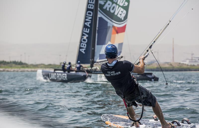 Kiteboarder Tom Buggy takes on the Land Rover Extreme 40 photo copyright Lloyd Images taken at Oman Sail and featuring the Extreme 40 class