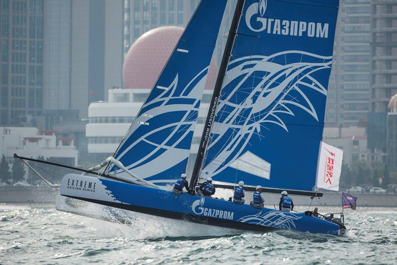 Gazprom Team Russia punch their way through the swell on day 3 of the Land Rover Extreme Sailing Series Act 3 Qingdao, for the 'Double Star Mingren' Cup photo copyright Lloyd Images taken at  and featuring the Extreme 40 class