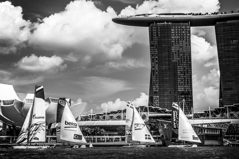 The Extreme 40 fleet race in front of the iconic backdrop of Singapore including the Marina Bay Sands Hotel and the Arts & Science museum on day 1 of Extreme Sailing Series Act 1, Singapore 2015 photo copyright Lloyd Images taken at  and featuring the Extreme 40 class