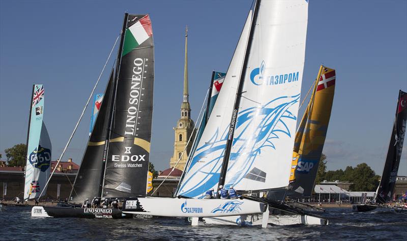 Gazprom Team Russia lead the fleet past the Peter and Paul Fortress on day 1 of Extreme Sailing Series Act 6, St Petersburg photo copyright Lloyd Images taken at  and featuring the Extreme 40 class