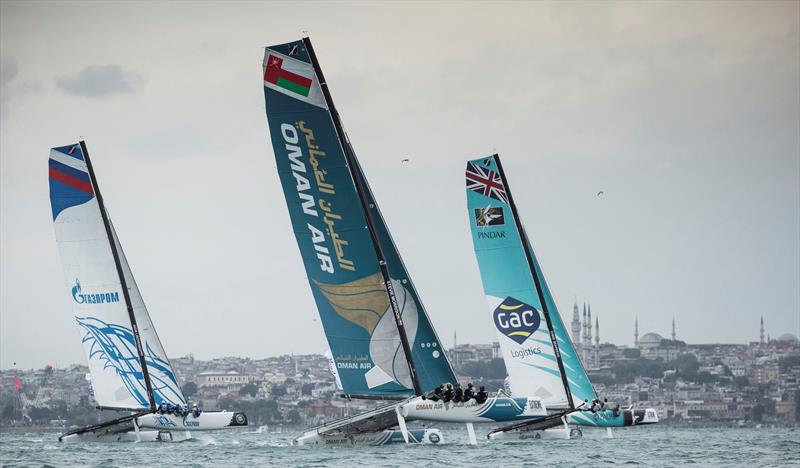 The fleet power around the track against the city backdrop on day 1 of Extreme Sailing Series Act 7, Istanbul photo copyright Lloyd Images taken at  and featuring the Extreme 40 class