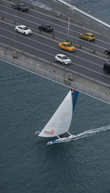 Oman Air flying under one of the famous Bosphorus bridges on day 3 of Extreme Sailing Series Act 7, Istanbul photo copyright Lloyd Images taken at  and featuring the Extreme 40 class