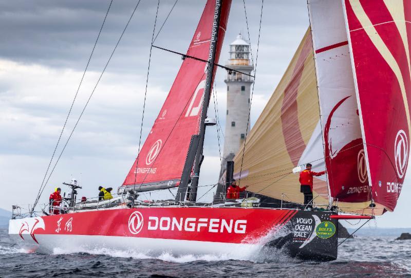 The Chinese Dongfeng Race Team - the first of the VO65s to round the Fastnet Rock in the Rolex Fastnet Race photo copyright Rolex / Kurt Arrig taken at Royal Ocean Racing Club and featuring the Volvo One-Design class