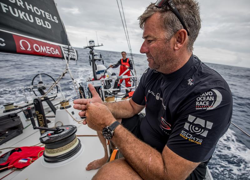 David Witt repairs his hands on board Sun Hung Kai Scallywag photo copyright Konrad Frost / Volvo Ocean Race taken at  and featuring the Volvo One-Design class