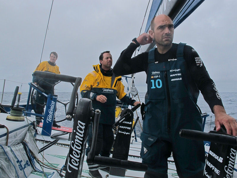 Skipper Iker Martinez at the deck with Xabi Fernandez and Joao Signorini onboard Team Telefonica during leg 4 of the Volvo Ocean Race