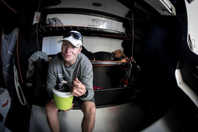 Volvo Ocean Race Leg 4, Melbourne to Hong Kong, day 11 Trystan Seal having breakfast on board Sun Hung Kai / Scallywag photo copyright Konrad Frost / Volvo Ocean Race taken at  and featuring the Volvo One-Design class