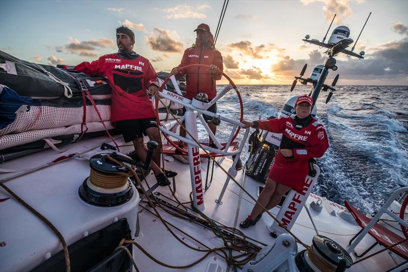 Leg 4, Melbourne to Hong Kong, day 15 on board MAPFRE, Guillermo Altadill, Rob Greenhalgh and Tamara Echegoyen during the sunrise . - photo © by Ugo Fonolla / Volvo Ocean Race. 15 January, .