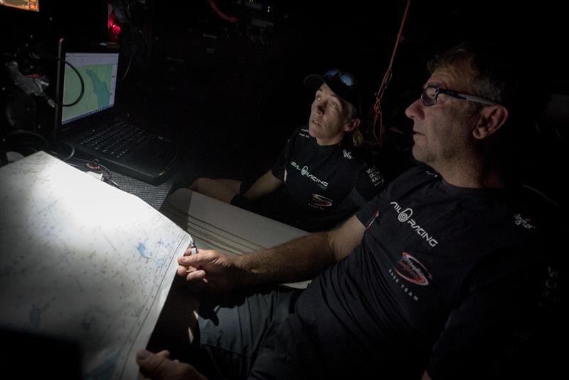 Leg 4, Melbourne to Hong Kong, day 5 Libby Greenhalgh and David Witt checking the navigation on board Sun Hung Kai / Scallywag photo copyright Konrad Frost / Volvo Ocean Race taken at  and featuring the Volvo One-Design class