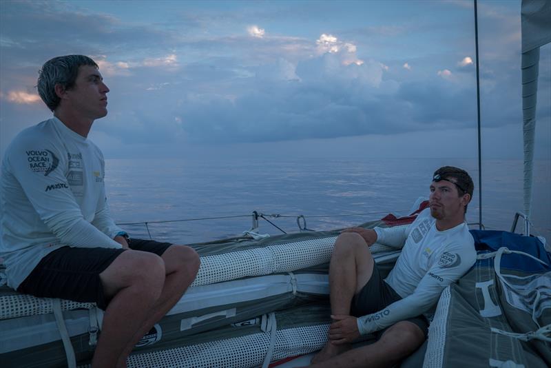 Leg 6 to Auckland, day 17 on board Brunel. No wind offshore from New Caledonia. Carlo Huisman and Alberto Bolzan sitting at the bow waiting for wind. 23 February,  photo copyright Yann Riou / Volvo Ocean Race taken at  and featuring the Volvo One-Design class