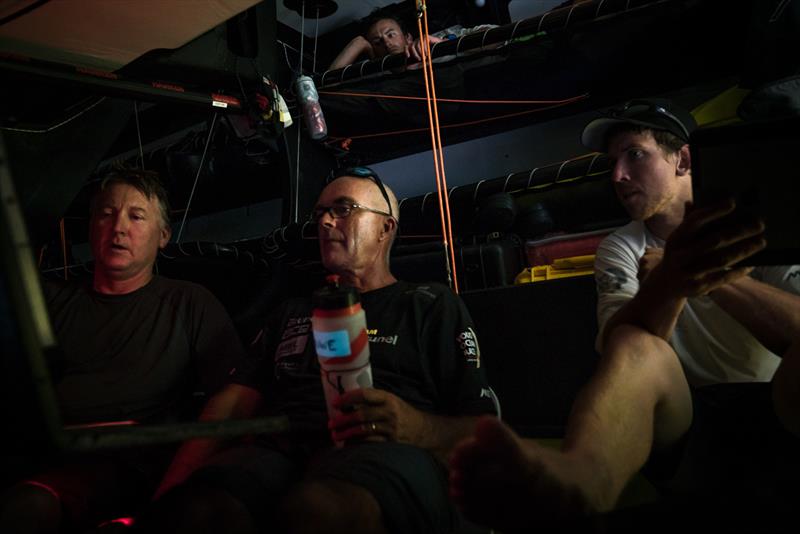 Leg 6 to Auckland, day 18 on board Brunel. 24 February, . Checking on the nav for navigator Andrew Cape, skipper Bouwe Bekking and watch captain Peter Burling. Louis Balcaen watching from his bunk - photo © Yann Riou / Volvo Ocean Race
