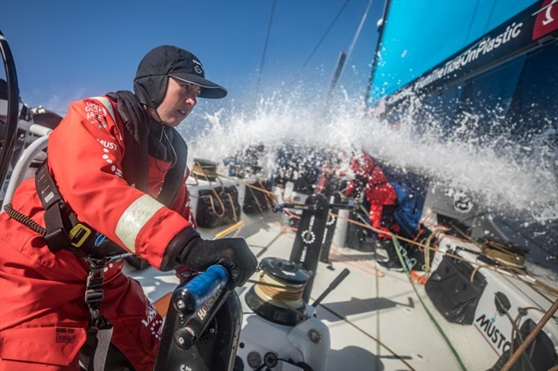 Volvo Ocean Race Leg 7 from Auckland to Itajai, day 03 on board Vestas 11th Hour. Hannah Diamond grinding while Nick is trimming under the hatch. - photo © Jeremie Lecaudey / Volvo Ocean Race