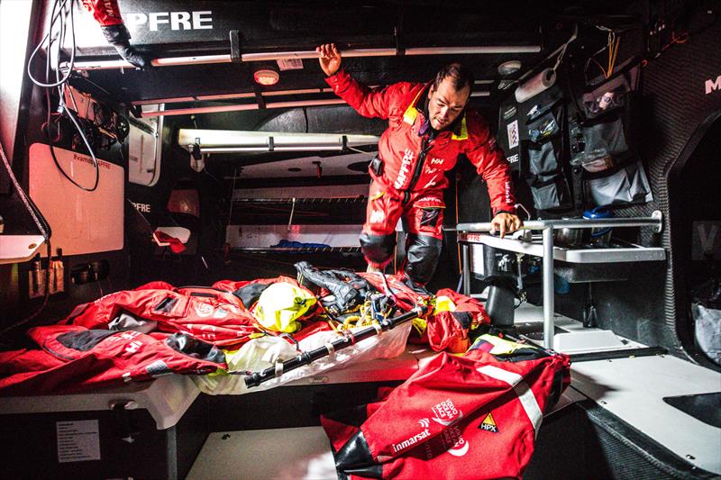 Leg 7 from Auckland to Itajai, day 08 on board MAPFRE, Pablo Arrarte moving the wet weather gear in one of the gybes. 24 March,  photo copyright Ugo Fonolla / Volvo Ocean Race taken at  and featuring the Volvo One-Design class