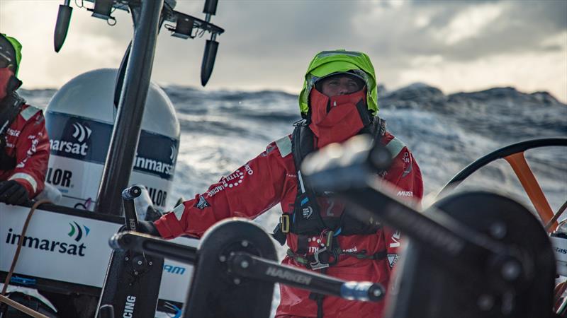 Leg 7 from Auckland to Itajai, day 08 on board Vestas 11th Hour. 25 March, . Stacey Jackson waiting to grind under the cold, appreciates this rare moment of sunshine photo copyright Jeremie Lecaudey / Volvo Ocean Race taken at  and featuring the Volvo One-Design class