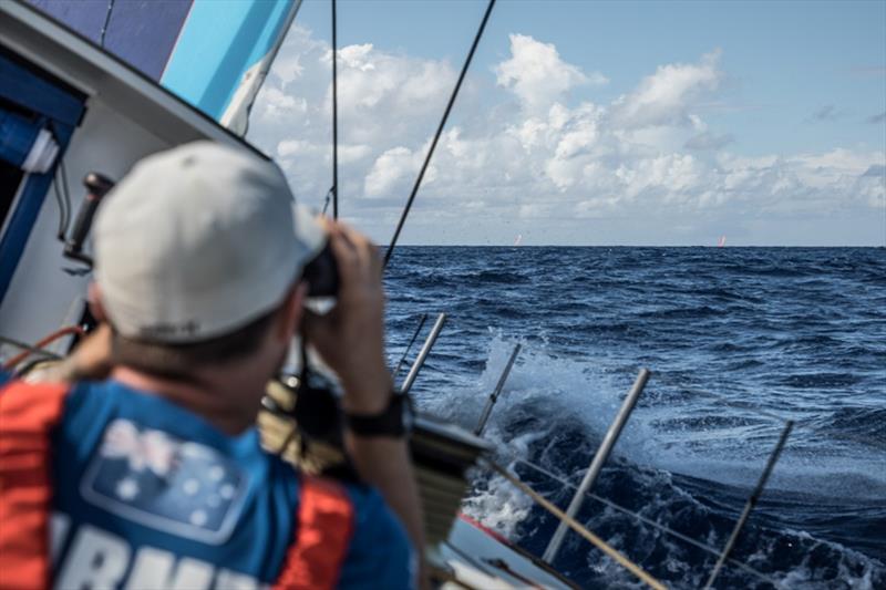 Volvo Ocean Race Leg 8 from Itajai to Newport, day 02 on board Vestas 11th Hour. Phil Harmer look at the red boats. - photo © Martin Keruzore / Volvo Ocean Race