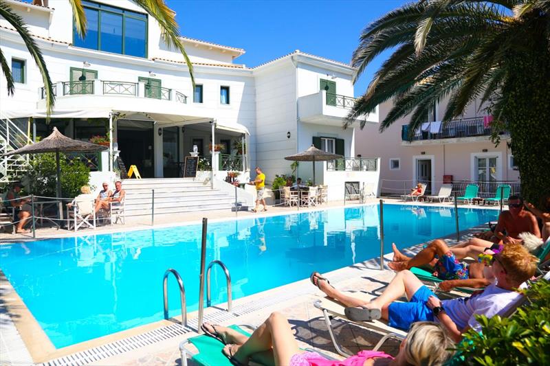 Relaxing near the swimming pool of on-site Wildwind Vassiliki Melas hotel photo copyright Georgina Craig Harvey taken at  and featuring the  class
