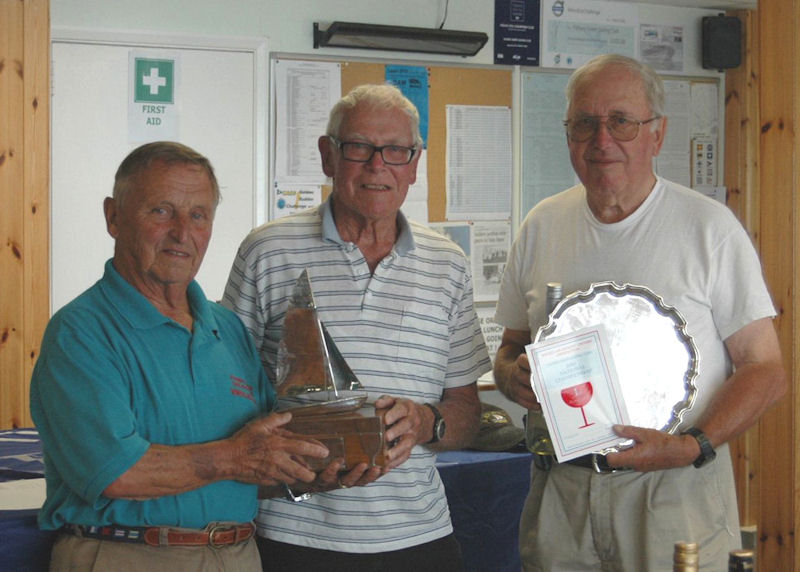 Brian Conroy & Ron Elston receive the Wineglass Trophy from Wineglass designer Trevor Kirby photo copyright Edna Conroy taken at Fishers Green Sailing Club and featuring the Wineglass class